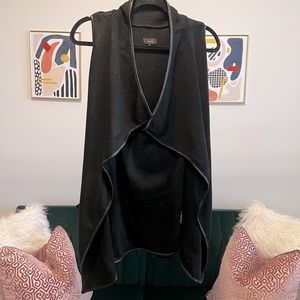 Belted, sweater vest.